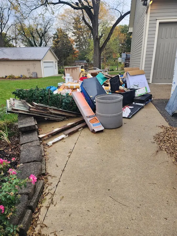 Dumpster being loaded with debris for 10 Yard Dumpster Rental in Piedmont